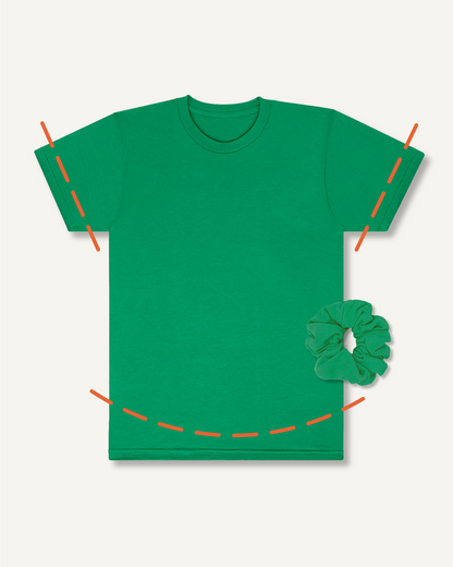 Green t-shirt with: (1) an arced orange dotted line above the shirt's hemline, implying the t-shirt will be cropped and finished with a round hemline, (2) straight orange dotted lines across both sleeves, implying the shirt’s sleeves will be shortened, and (3) a matching green scrunchie, implying the t-shirt's scraps will be made into a Scrap Scrunchie.